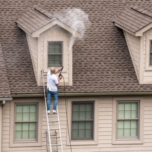 pressure washing a house